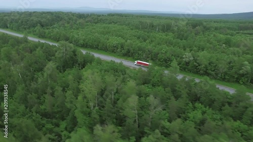 Wallpaper Mural Trucks driving / traveling on the forest asphalt road aerial footage / top view / Highway truck traffic Torontodigital.ca