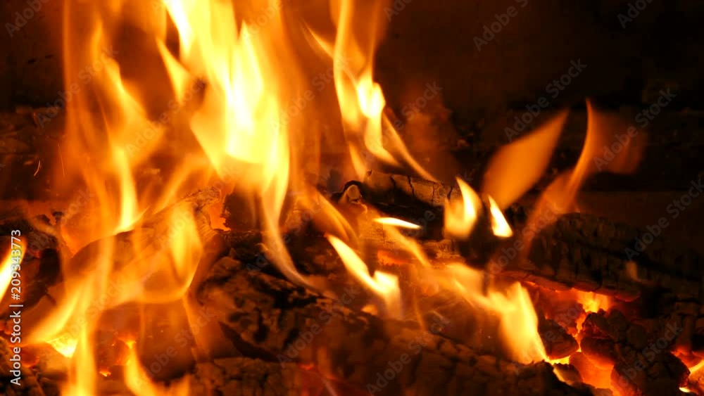 Slow motion of Fireplace burning. Warm cozy burning fire in a brick fireplace close up. Cozy background. Bright burning wood, campfire ... Slow motion of Fireplace burning. Warm cozy burning fire in a brick fireplace close up. Cozy background. Bright burning wood, campfire ...