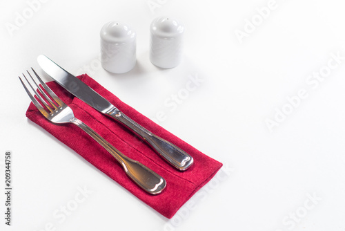 Fork and knife on red napkin