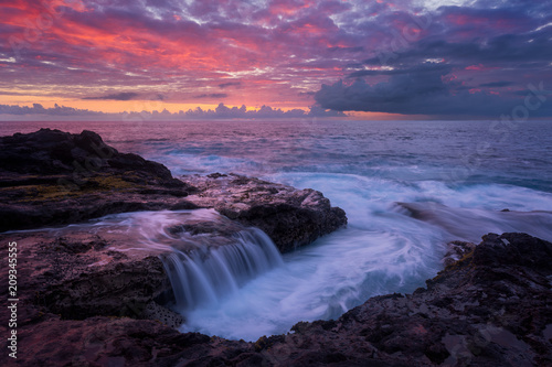 Pink sunset at Pointe des Chateaux in Saint Leu, Reunion Island