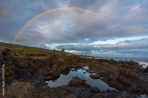 Rainbow in the sky of Etang Sale in Reunion Island