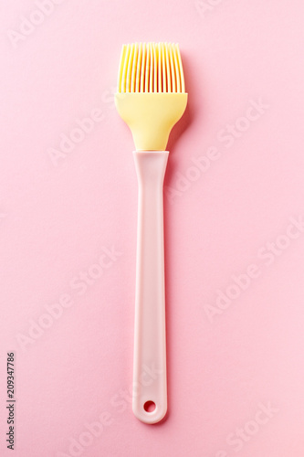 Silicone pastry brush on pink  from above