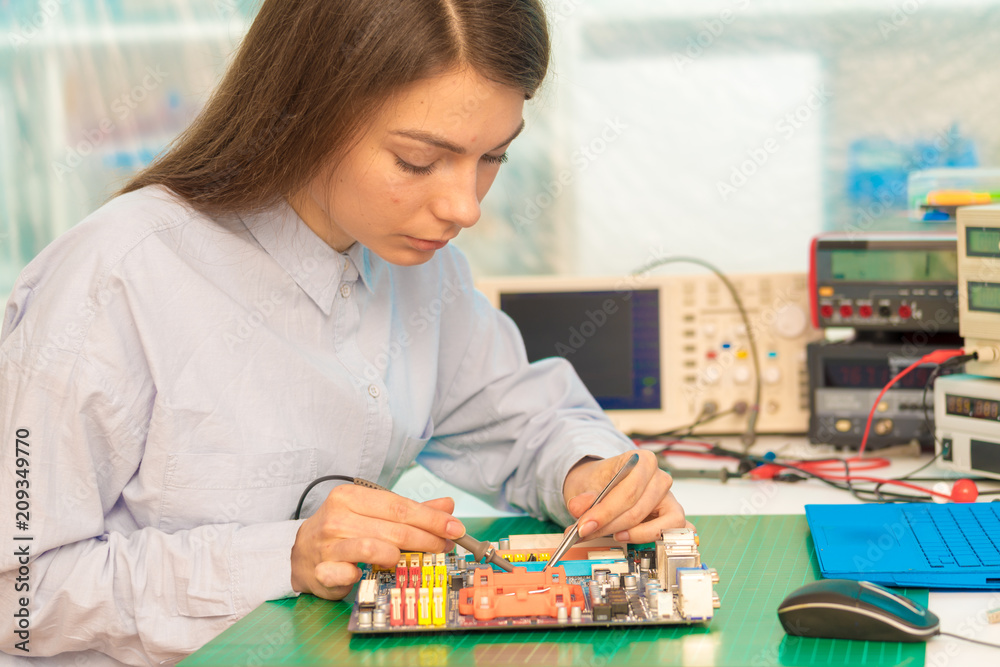 Fototapeta premium girl student in the class physics and electronics