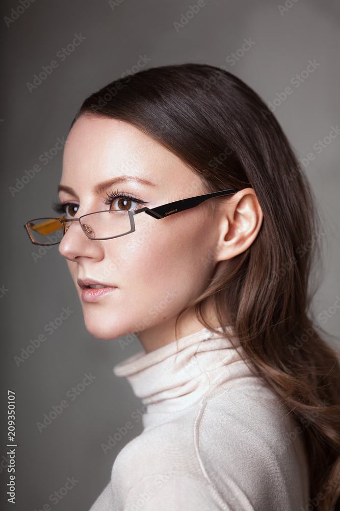 Woman female teacher Wearing Glasses in white light beige sweater turtle neck