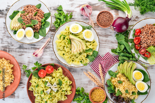 A set of food from buckwheat  bulgur and pasta. On a wooden background. Top view. Copy space.