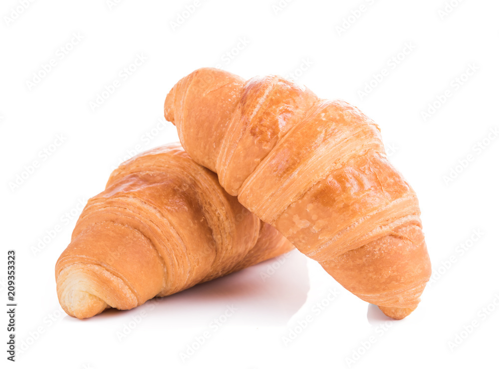 Two croissants on a white background. Two croissants on a white background.