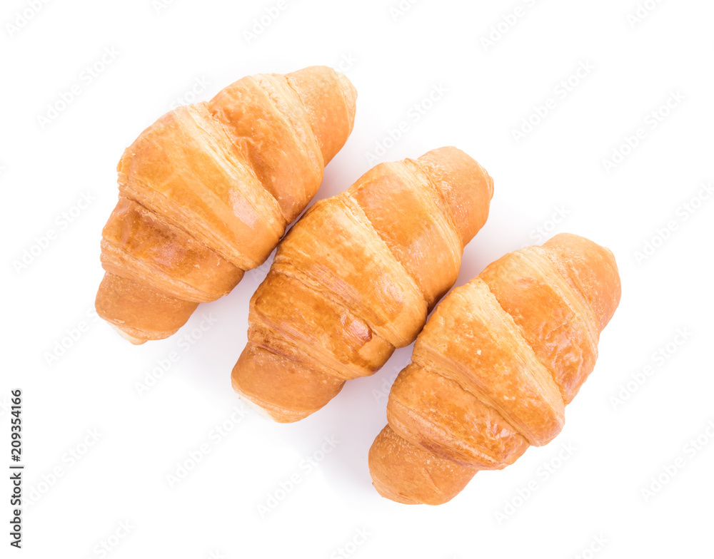 Three fresh croissants isolated over white background Three fresh croissants isolated over white background