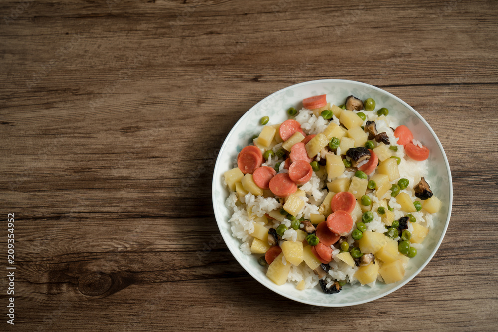 Wooden background and cooked rice Wooden background and cooked rice