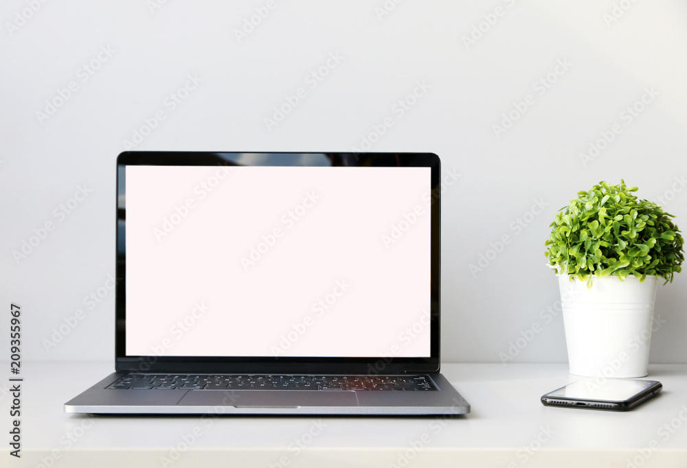 Working with Laptop computer,Hot coffee and plant copy space on desk background,business Concept Working with Laptop computer,Hot coffee and plant copy space on desk background,business Concept