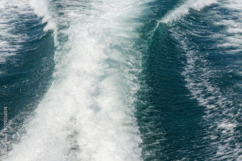 Sea waves splashing, yacht track