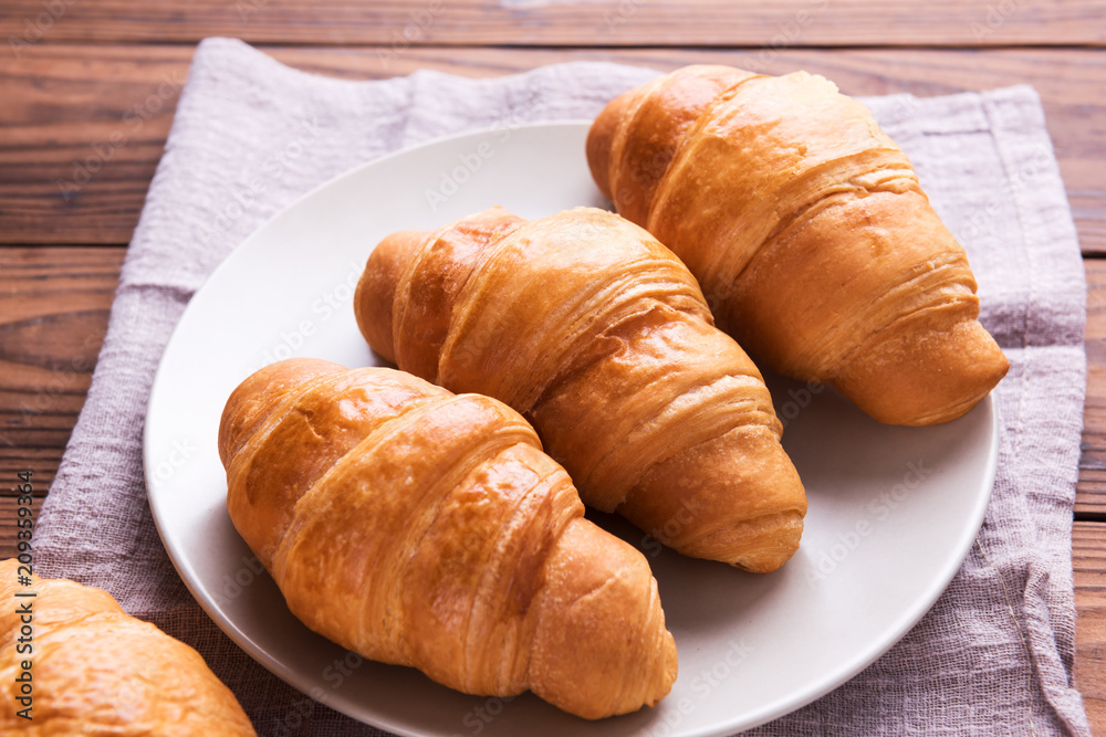 Freshly baked butter croissant. Closeup