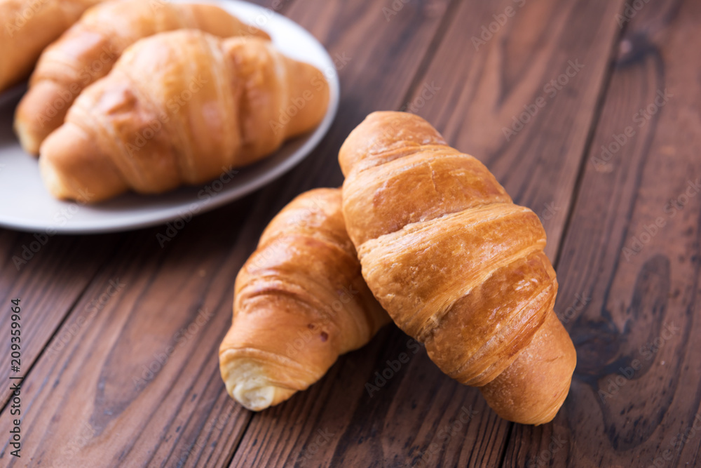 Freshly baked butter croissant. Closeup