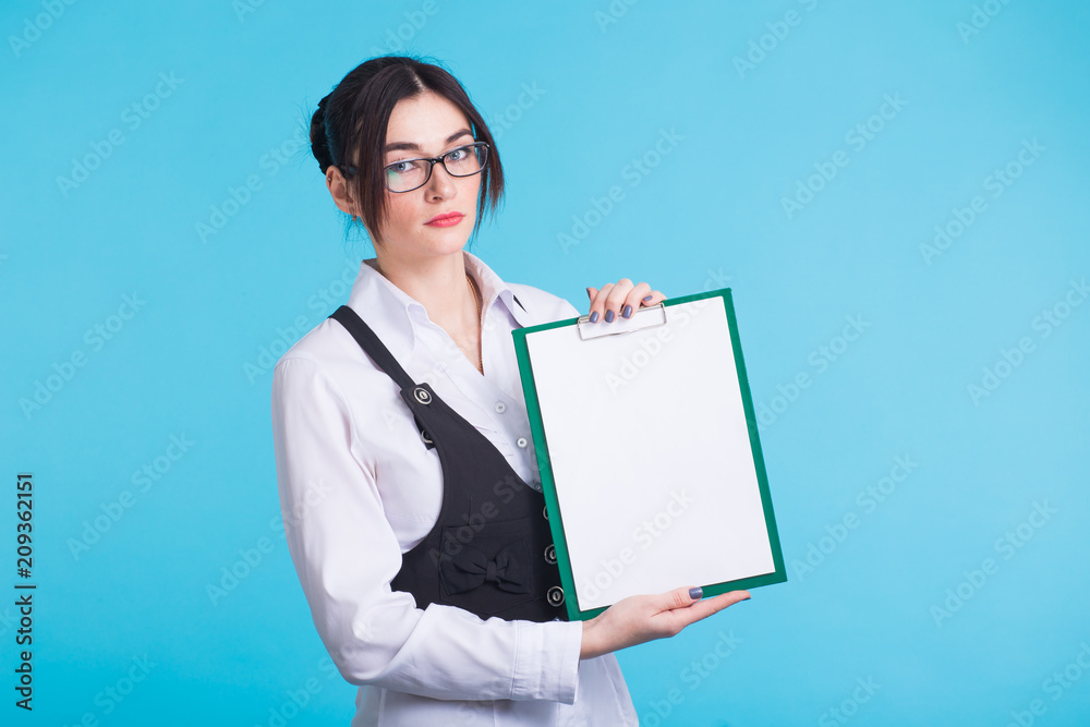 Portrait of a beautiful happy business woman holding a blank billboard. Ready to add text Portrait of a beautiful happy business woman holding a blank billboard. Ready to add text