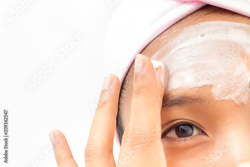 A woman is marking a face. photo