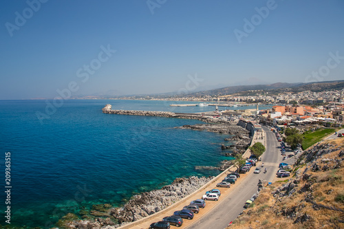 harbor and lighthouse of the city of rethymno in in crete greece  photo