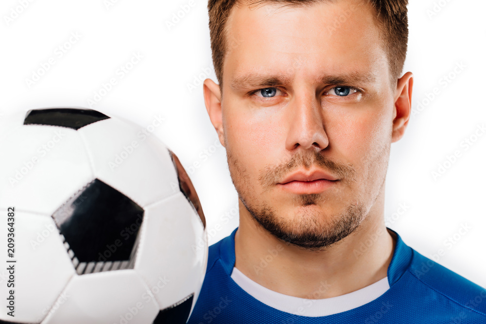 Close-up portrait of young handsome football player soccer posing on white isolated. Close-up portrait of young handsome football player soccer posing on white isolated.