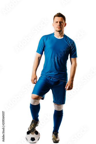 Obraz na płótnie Young handsome football player with a soccer ball posing isolated on white background