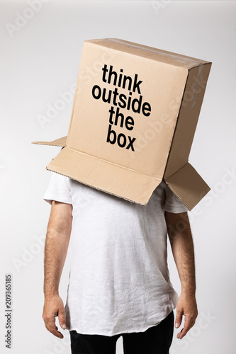 Man with box on his head, think outside the box