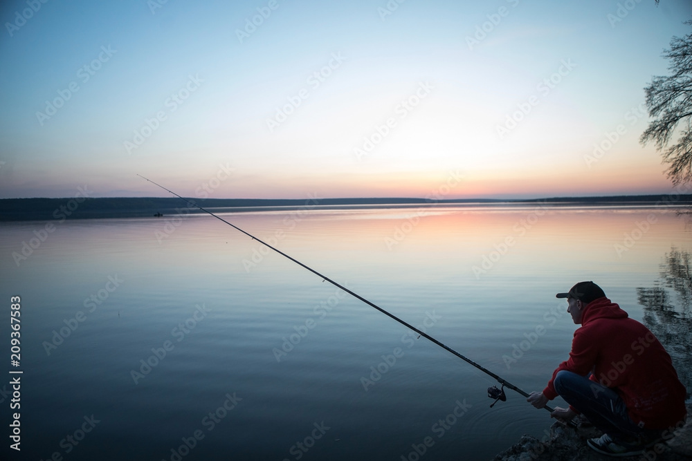 Fishing rod lake fisherman caucasian men sport summer lure sunset water outdoor suinset pond lake river fish