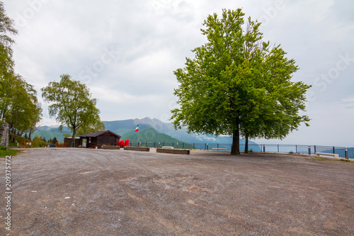 Balcony of Italy - Panorama of Lake Lugano in cloudy day. Alps with Mount blanc in background. Lombardia, Italy photo