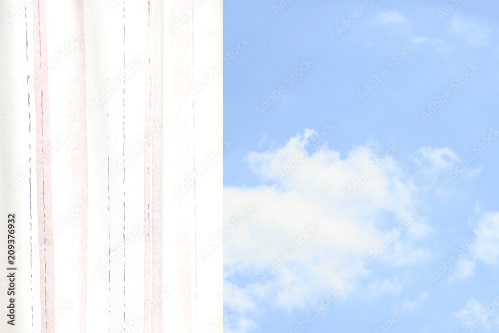 Bright striped airy curtain with view to sky on a summer day. Bright striped airy curtain with view to sky on a summer day.