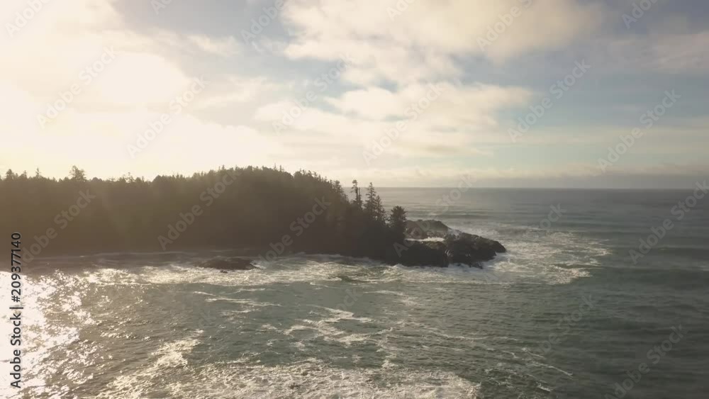 Aerial view of the beautiful Seascape at the Pacific Ocean Coast during a vibrant winter sunrise. Taken near Tofino and Ucluelet in Vancouver Island, British Columbia, Canada. Aerial view of the beautiful Seascape at the Pacific Ocean Coast during a vibrant winter sunrise. Taken near Tofino and Ucluelet in Vancouver Island, British Columbia, Canada.