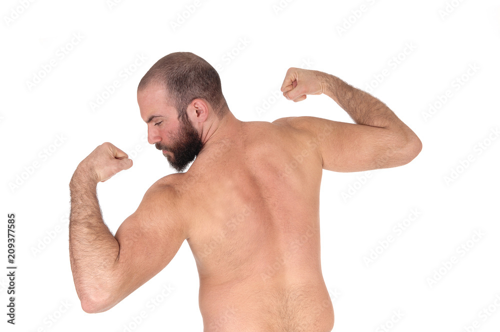 Man standing from back shirtless showing his muscles Man standing from back shirtless showing his muscles