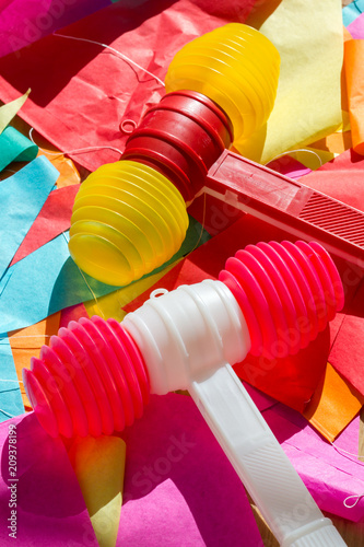 Bright colorful plastic toy hammers and bunting for celebrating the feast of St. John the Baptist in Porto, Portugal