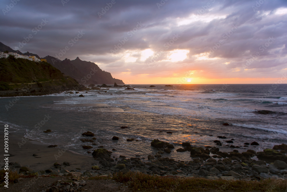 Sun setting in Atlantic ocean. View from Playa de Benijo, Tenerife Island