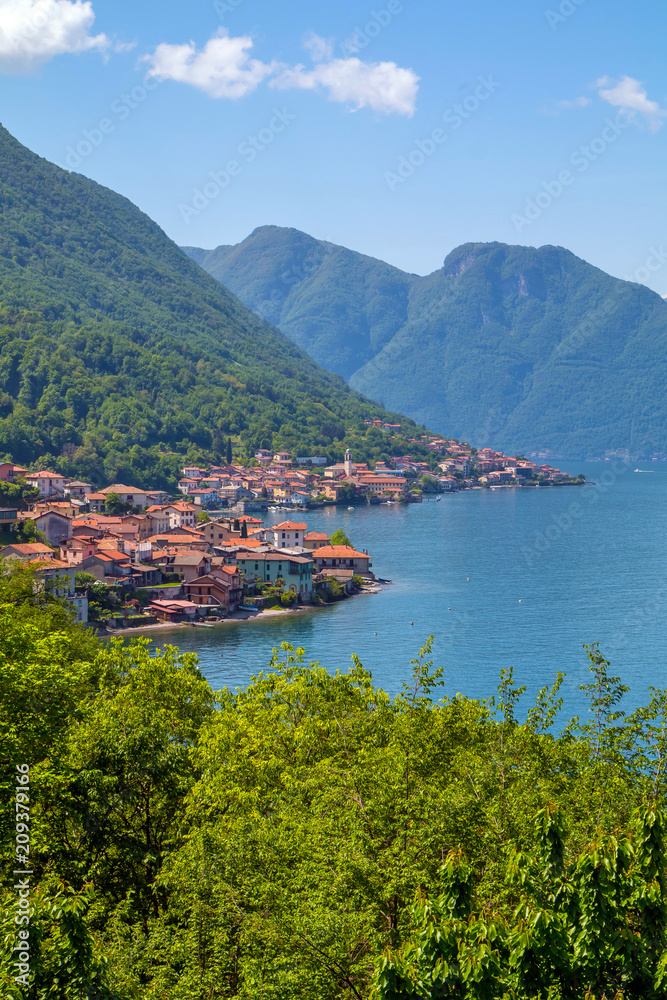holidays in Italy - a view of the most  beautiful lake in Italy with town in background, Lago di Como, Lombardy, Italy
