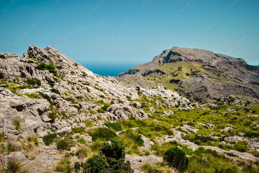 Field mountain landscapes. Seascape beyond the mountains. Majorca, Spain