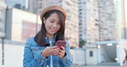 Photography Woman use of mobile phone at outdoor