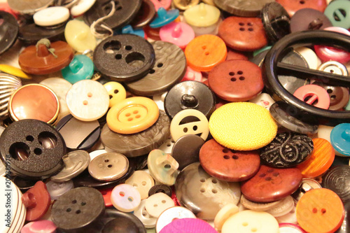 Buttons of different size and color. Background.