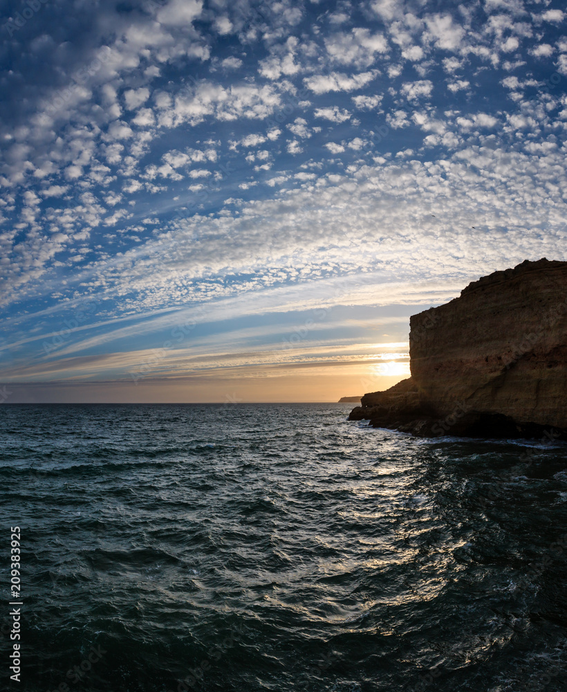 Sunset Atlantic rocky coastline, Algarve, Portugal