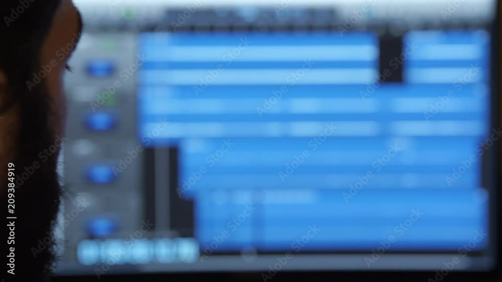 A man staring at his computer's screen. A man staring at his computer's screen.
