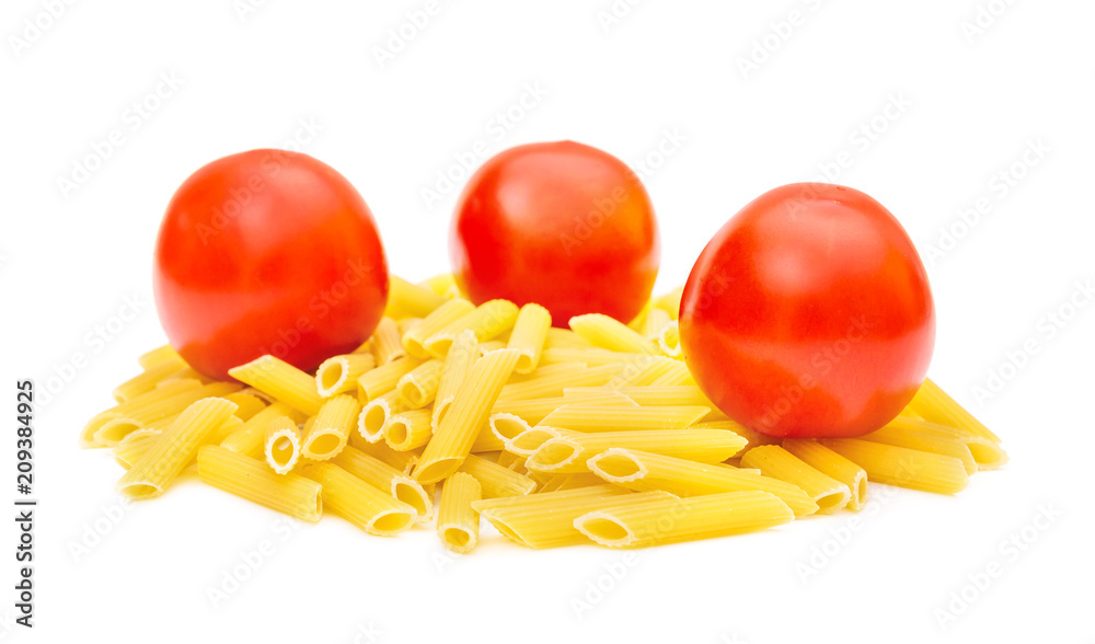 Heap of raw pasta with tomatoes on white.