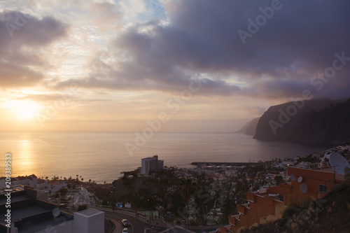 Beautifil view of the Los Gigantes and setting sun. Puerto de Santiago, Tenerife Island, Canary
