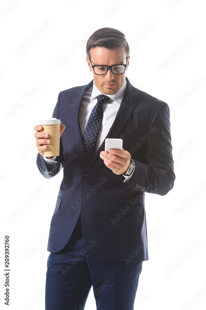 businessman in eyeglasses checking smartphone and holding paper cup of coffee isolated on white background businessman in eyeglasses checking smartphone and holding paper cup of coffee isolated on white background