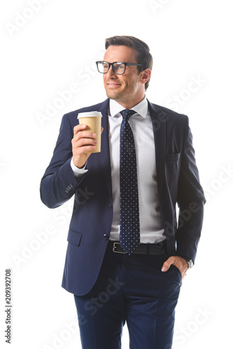 happy businessman in eyeglasses holding paper cup of coffee isolated on white background © LIGHTFIELD STUDIOS