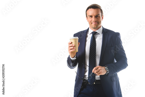 businessman holding eyeglasses and paper cup of coffee isolated on white background © LIGHTFIELD STUDIOS