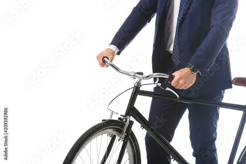 cropped image of businessman standing with bicycle isolated on white background