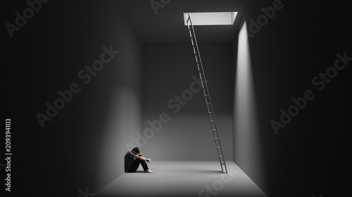 Ein Mann sitzt depressiv in einem Raum mit Leiter