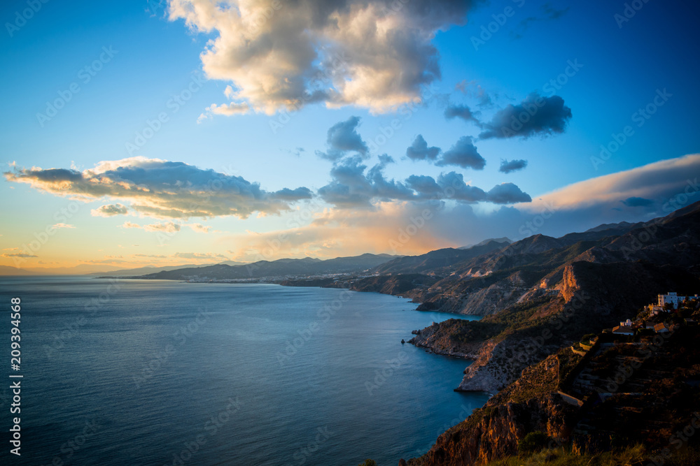 Fototapeta premium Granada, Spain; February 02, 2018: Sunset from the cliffs of Maro in Cerro Gordo