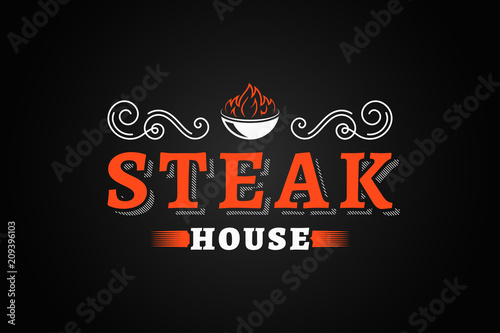 steak house vintage logo with fire flame on black background