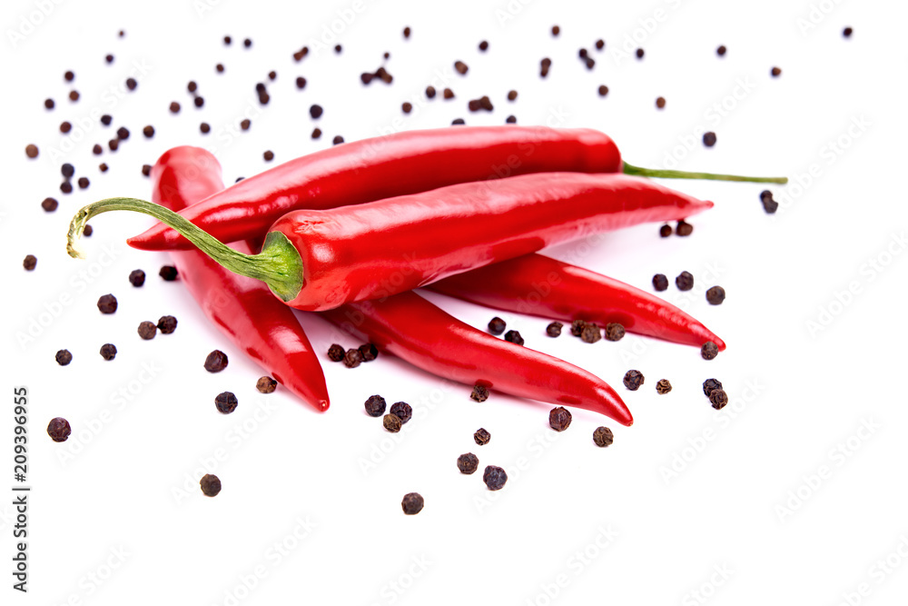 Red and green chilli peppers & black peppercorns, hot cooking spices, Isolated against a white background. Red and green chilli peppers & black peppercorns, hot cooking spices, Isolated against a white background.