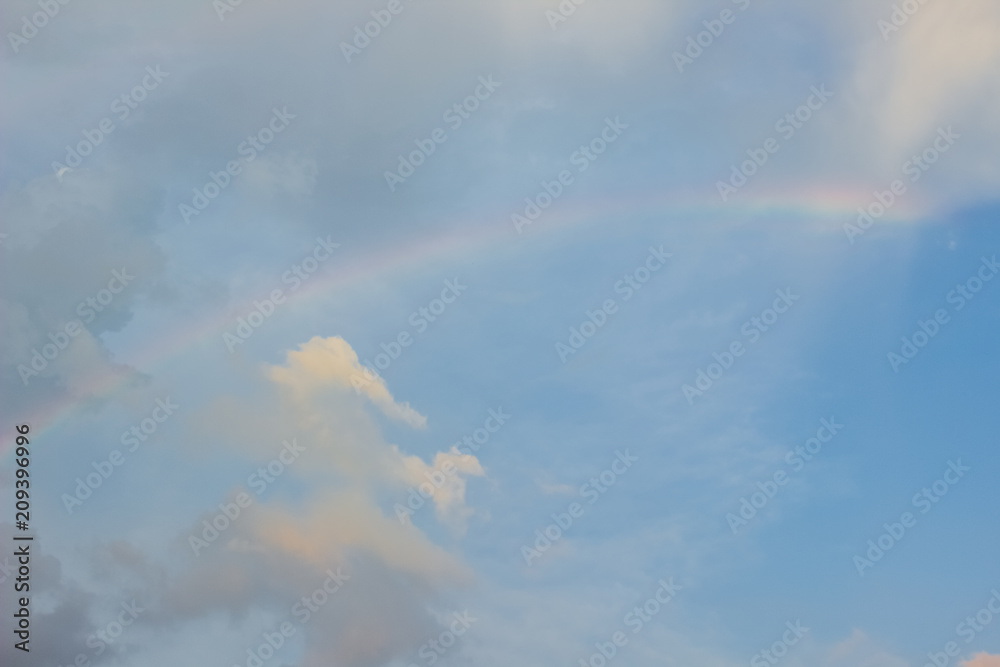 blue sky background with rainbow concept and empty space for copy or text