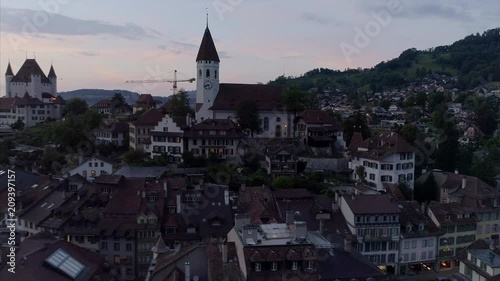 Aerial pan around of Thun City Bern, Switzerland. Drone footage captures Thun architecture, Thun Castle and Thun City church. photo