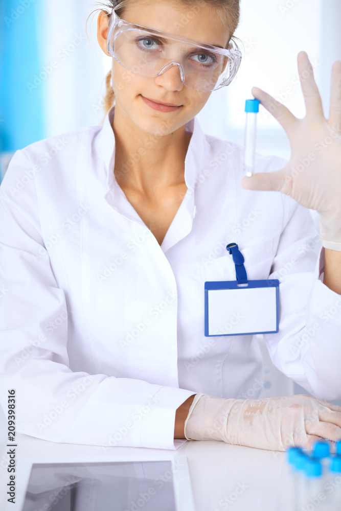 Female scientific researcher or blood test assistant in laboratory. Medicine concept Female scientific researcher or blood test assistant in laboratory. Medicine concept