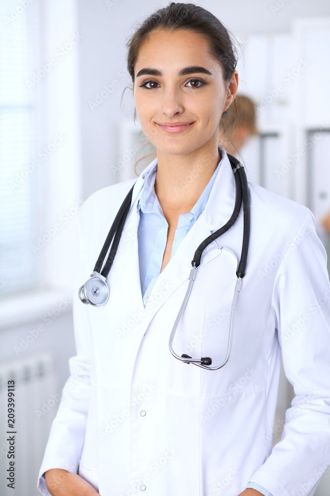 Portrait of young doctor woman  in hospital. Hispanic or latin american staff in medicine