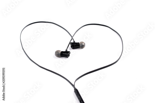Black headphones in the shape of a heart on a white background.